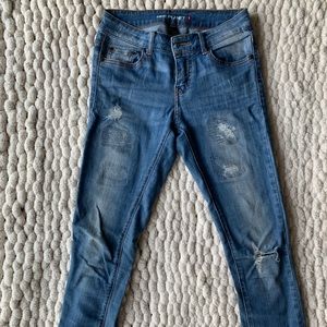 Distressed Mid-Rise Skinny Jeans